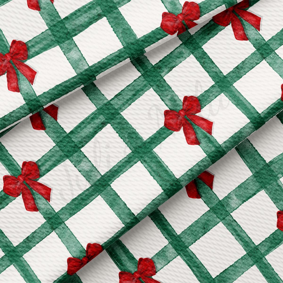 a green and white checkered fabric with red bows