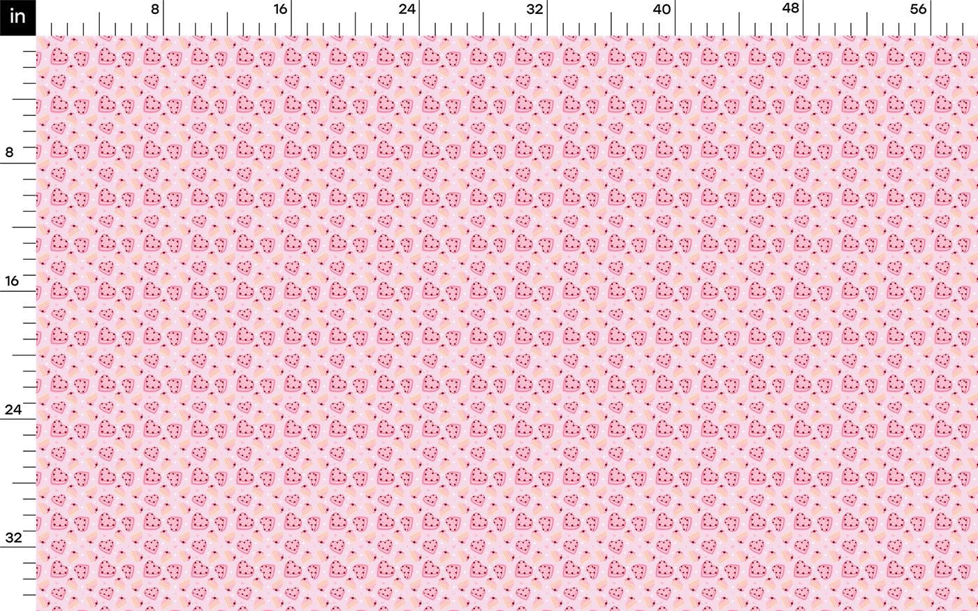 a ruler with a pink and white pattern on it