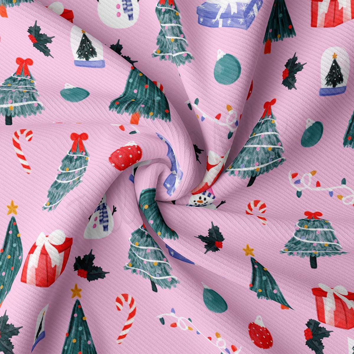 a pink background with christmas trees and candy canes