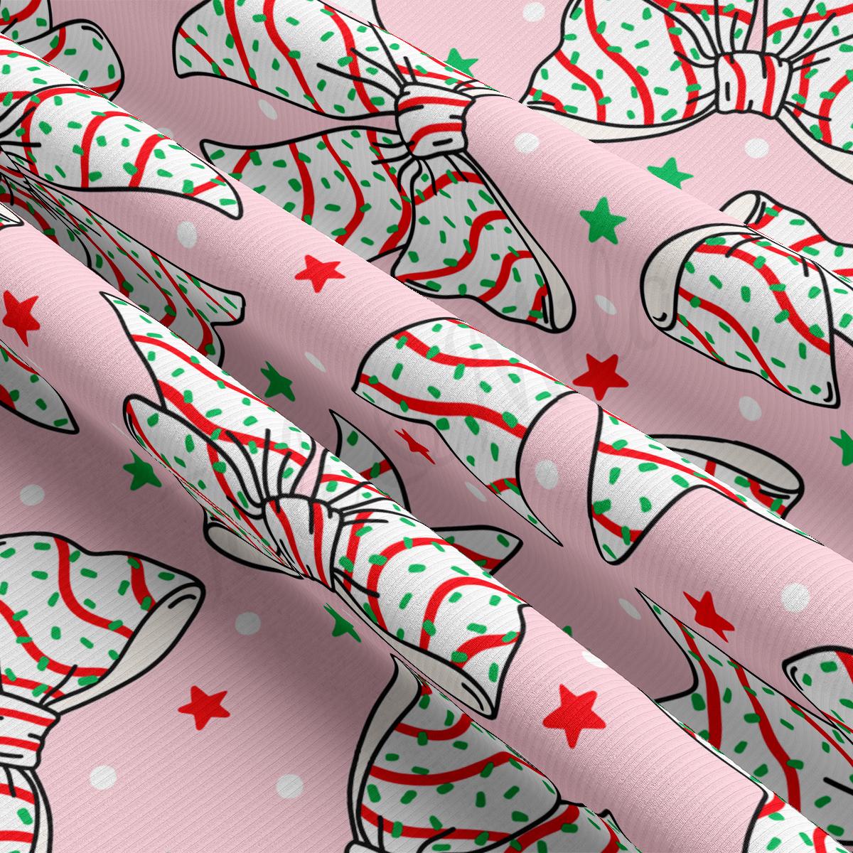 a pink wrapping paper with a pattern of christmas hats and stars